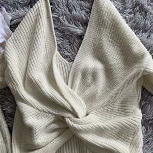 low cut sweater with tied knot in back